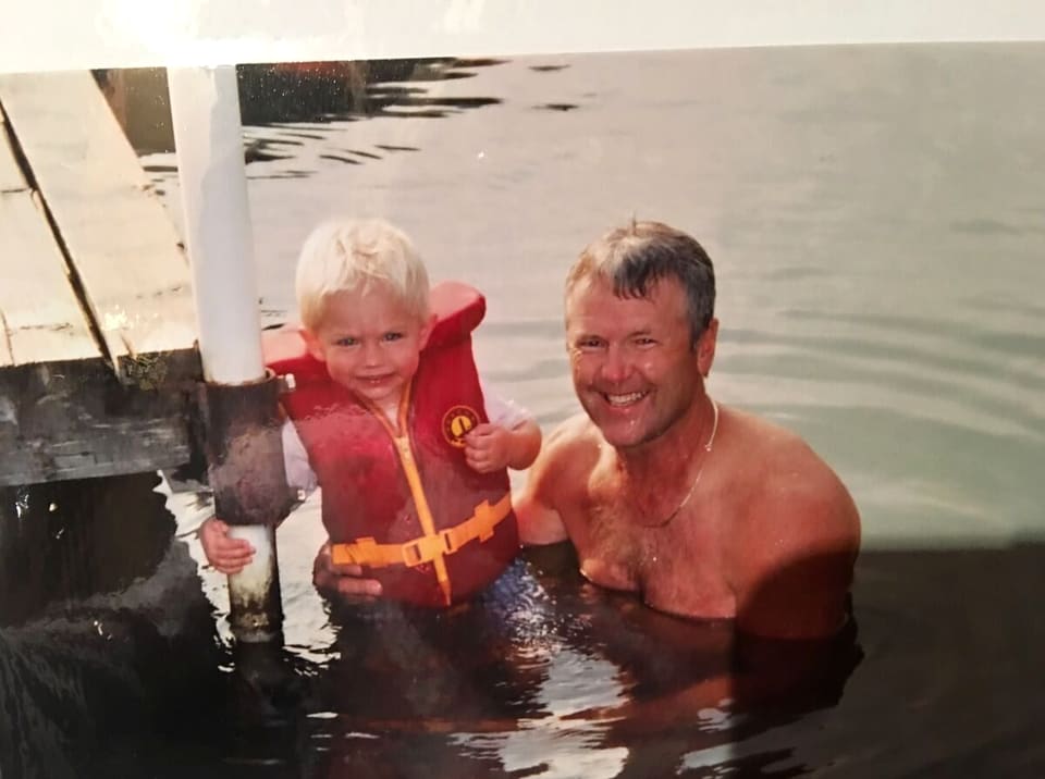 Ken Nelson in the water, steadying a young first-timer